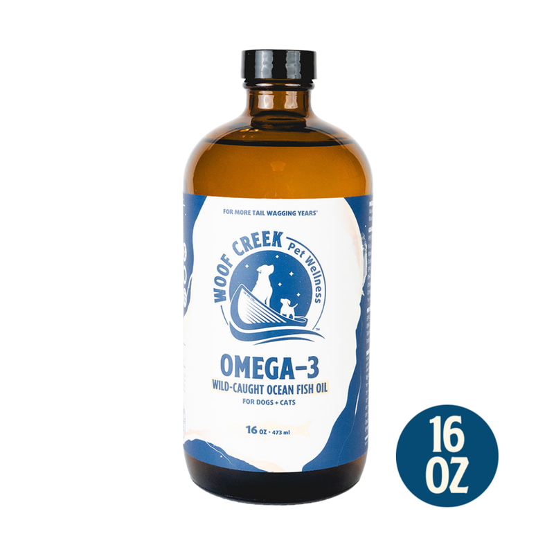 Omega-3 Ocean Fish Oil in a 16 fl oz glass bottle for dogs and cats, from Woof Creek Pet Wellness, with fish oil capsules visible.