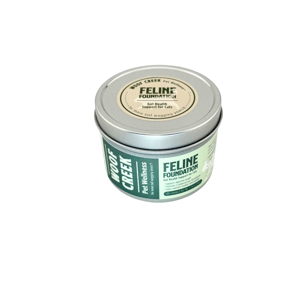 Woof Creek Feline Foundation tin, top-down angle showing the round lid label
