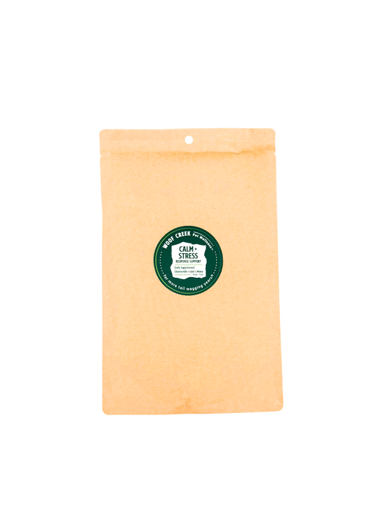 Woof Creek Pet Wellness Calm + Stress Response Support eco-refill pouch for dogs and cats, featuring superfoods for calming and stress relief.