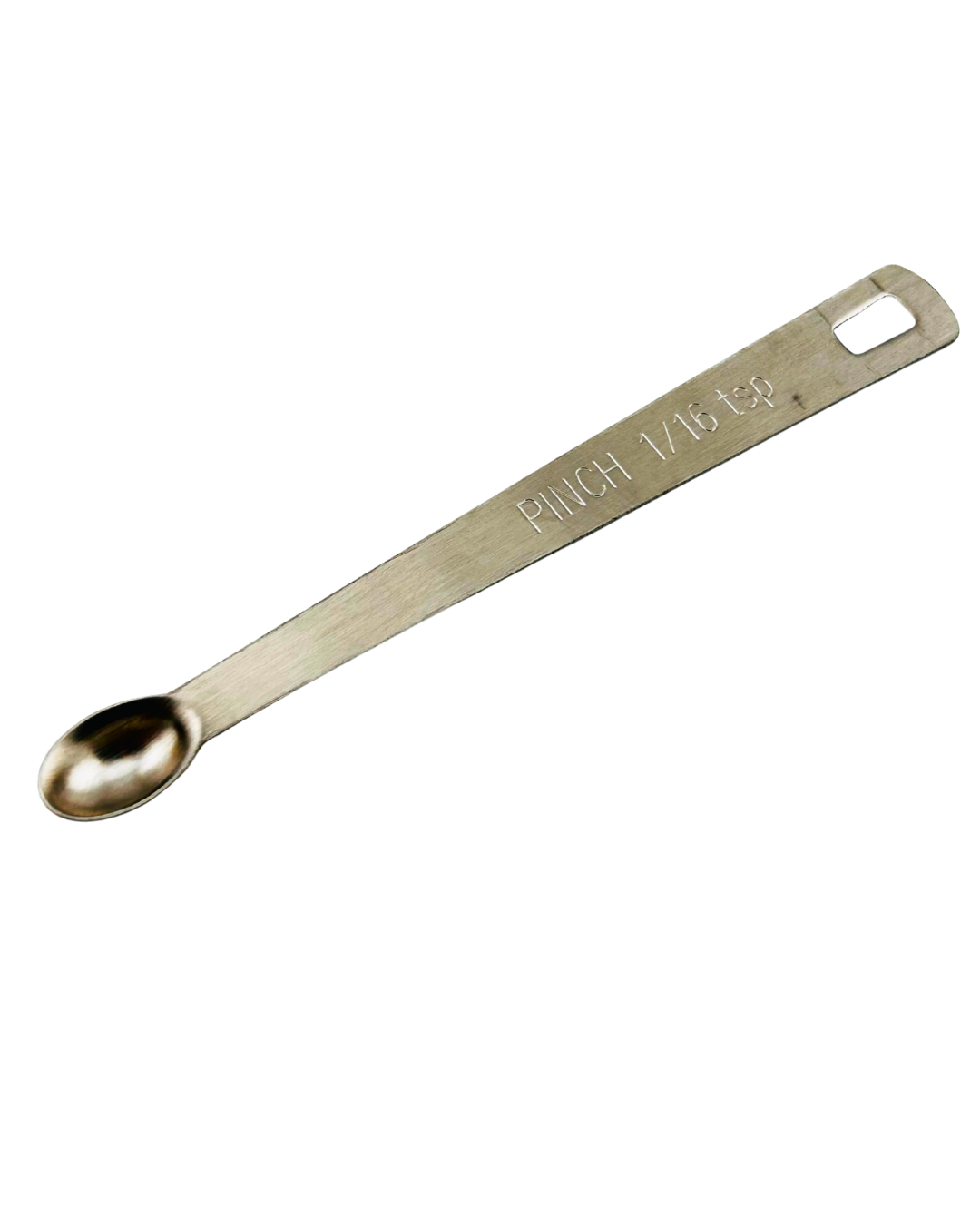 Metal measuring spoon for Ashwagandha powder, designed for dog supplies by Woof Creek Dog Wellness, showing a close-up of the spoon.