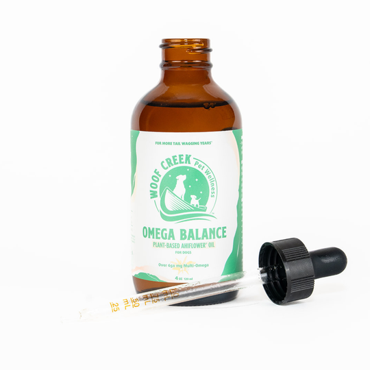 Woof Creek Pet Wellness Omega Balance Plant-Based Ahiflower® Oil in a 4oz glass bottle, suitable for dogs, pet superfood supplement.