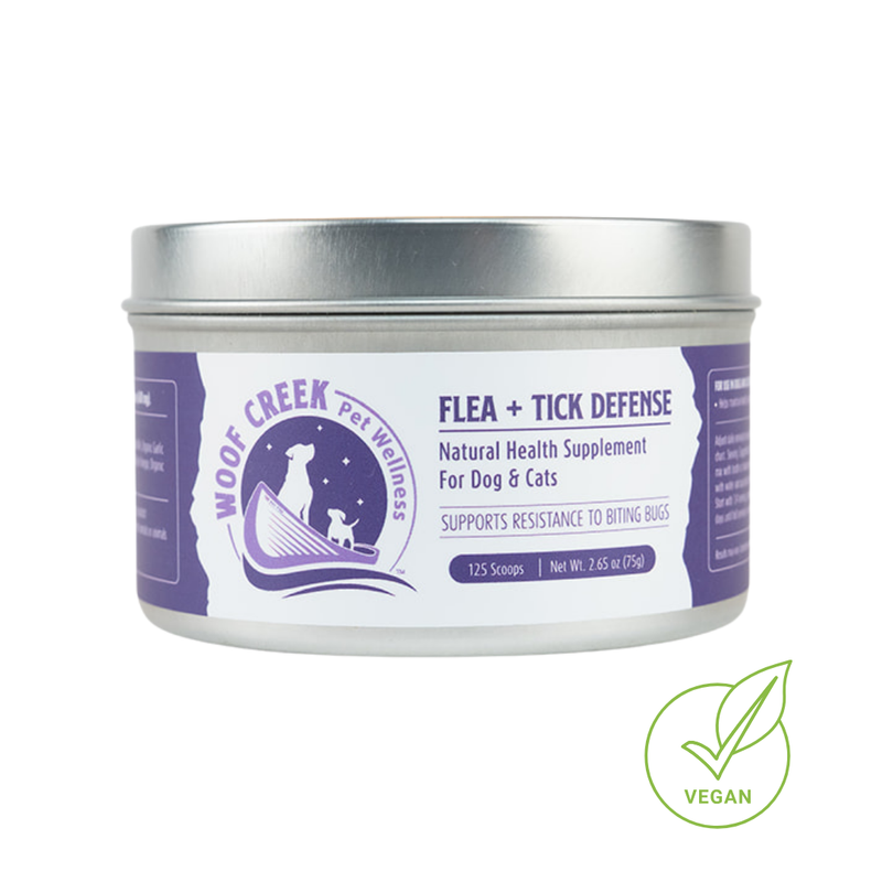 All-natural flea and tick defense support supplement for dogs and cats from Woof Creek Pet Wellness, showing the product packaging.